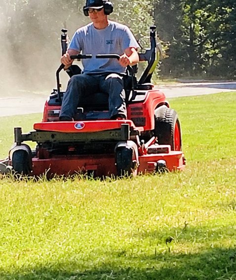 Zero-turn mower cutting a large lawn
